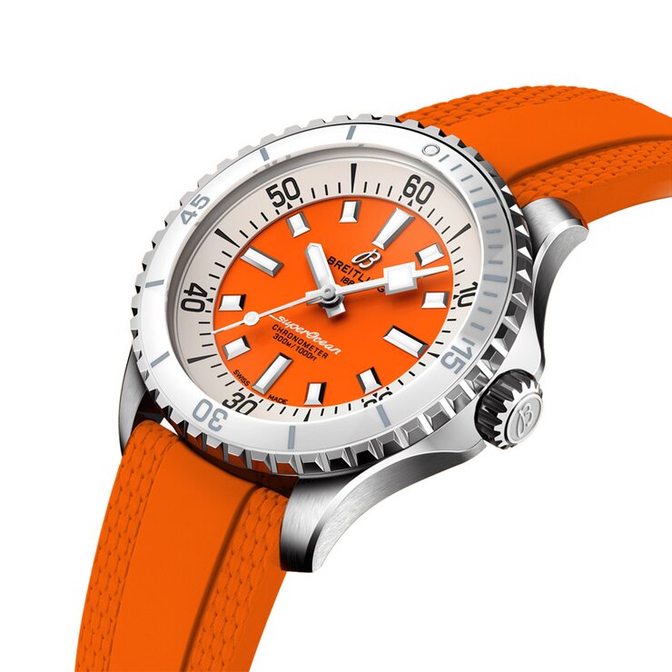 Breitling horloge met een kast in staal, met een wijzerplaat in het oranje en een diameter van 36 mm