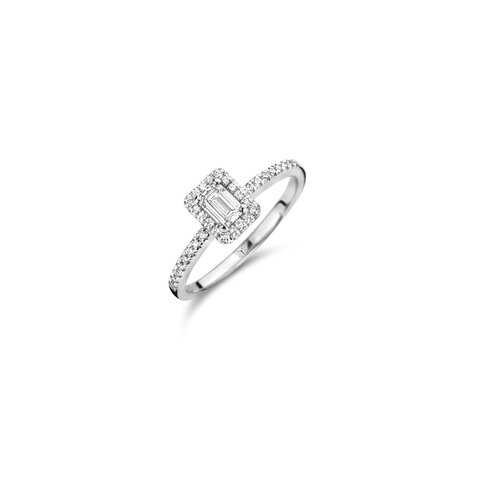The Exclusive Collection verlovingsring in wit goud 18kt met emerald diamant van 0,30 karaat als hoofdsteen omringd door briljanten van 0,25 karaat