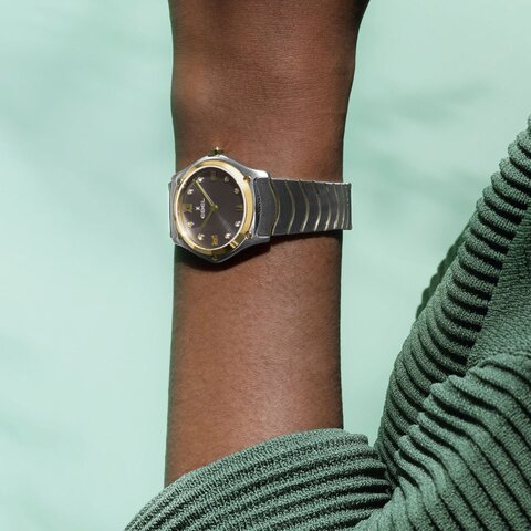Ebel horloge met een kast in geel goud op staal, met een wijzerplaat in het grijs met briljant en een diameter van 29 mm