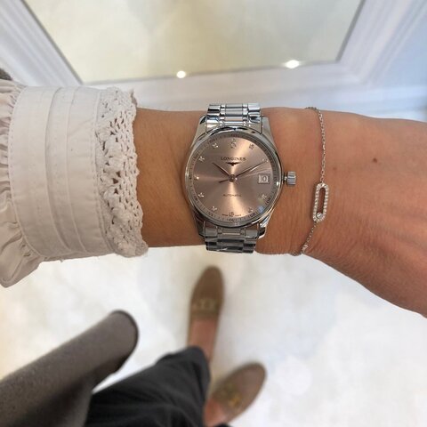 Longines horloge met een kast in staal, met een wijzerplaat in het beige+briljant en een diameter van 34 mm