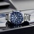 montre TAG Heuer avec un boîtier en acier, un cadran bleu et un diamètre de 44 - thumb
