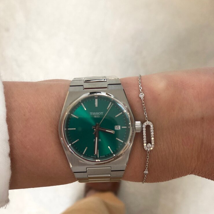 Tissot horloge met een kast in staal, met een wijzerplaat in het groen en een diameter van 35