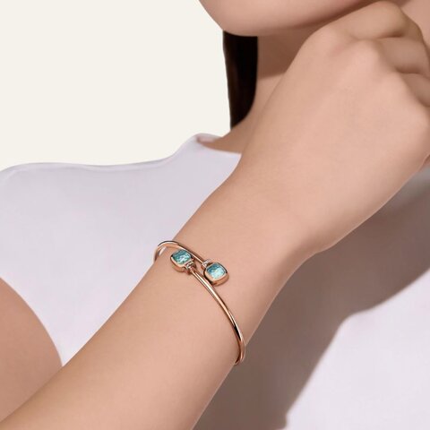 bracelet Pomellato en or rose 18 ct avec topaze bleue entouré de briljants de 0,02 karaat
