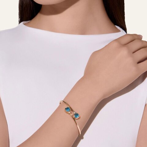 bracelet Pomellato en or rose 18 ct avec topaze bleu london entouré de briljants de 0,02 karaat