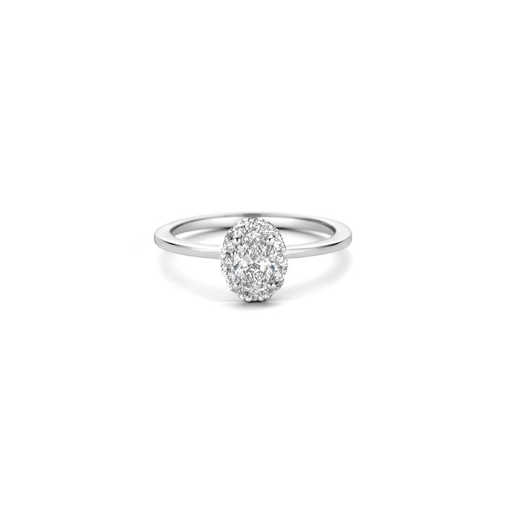 The Exclusive Collection verlovingsring in wit goud 18kt met ovalen diamant van 0,46 karaat als hoofdsteen omringd door briljanten van 0,18 karaat