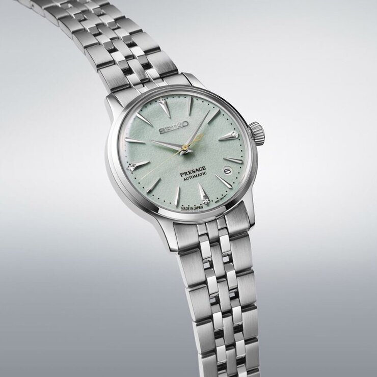 Seiko horloge met een kast in staal, met een wijzerplaat in het groen met briljant en een diameter van 34