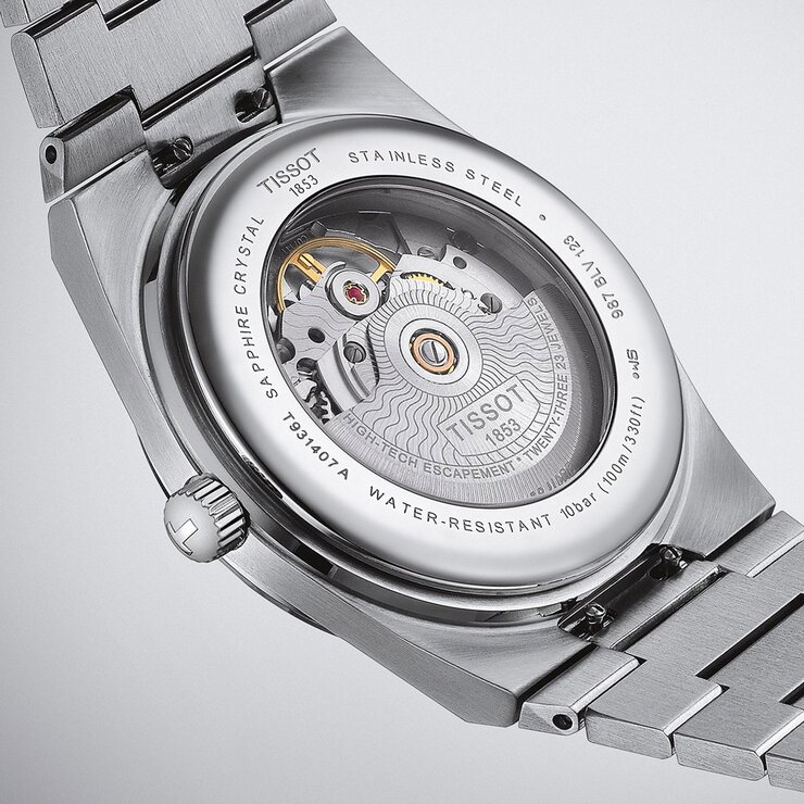 montre Tissot avec un boîtier en or rose sur acier, un cadran brun et un diamètre de 40 mm