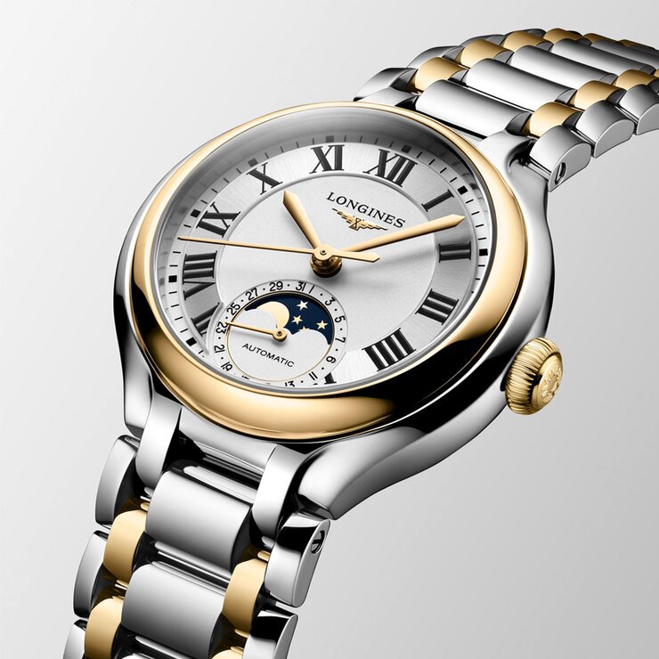 Longines horloge met een kast in geel goud op staal, met een wijzerplaat in het zilver en een diameter van 34 mm