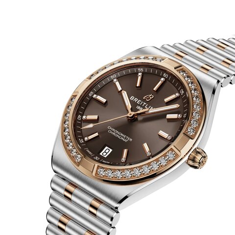 Breitling horloge met een kast in rosé goud op staal, met een wijzerplaat in het bruin met briljant en een diameter van 36 mm