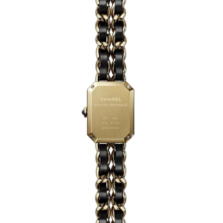 montre CHANEL avec un boîtier en acier revêtu d'or jaune 18 carats (0,1 micron), un cadran noir et un diamètre de 20 x 26 mm
