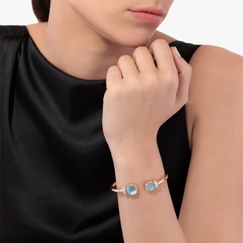 bracelet Pomellato en or rose 18 ct avec topaze bleue entouré de briljants de 0,49 karaat